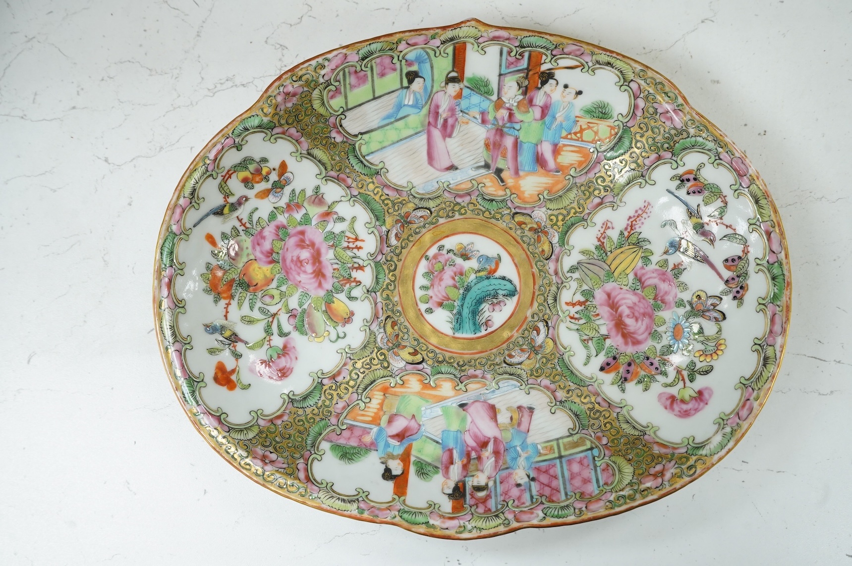 A 19th century Canton dish enamelled with figures and flowers, 27cm wide
